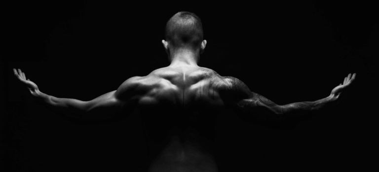 Man back arms raised
